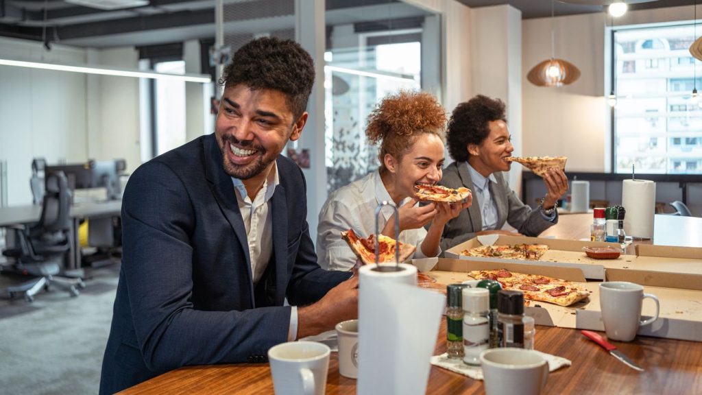 The great corporate buffet: Why companies will be giving out free pizza and bagels forever