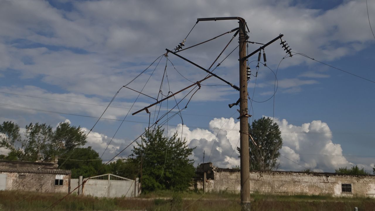 An electricity pylon and power lines in Kupiansk, Ukraine, damaged by shelling on May 23, 2023