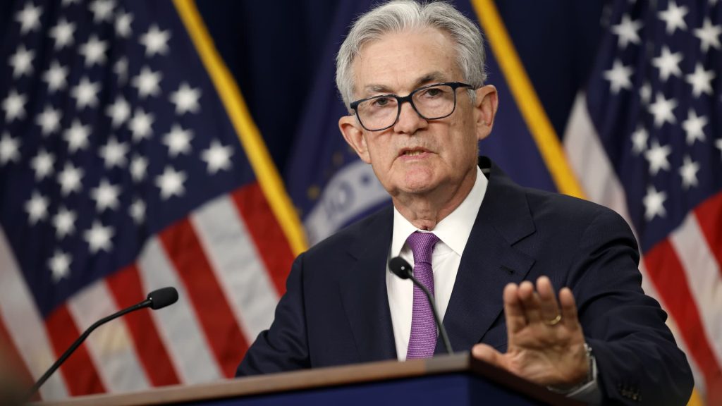 Fed Chair Powell calls talk of cutting rates ‘premature’ and says more hikes could happen